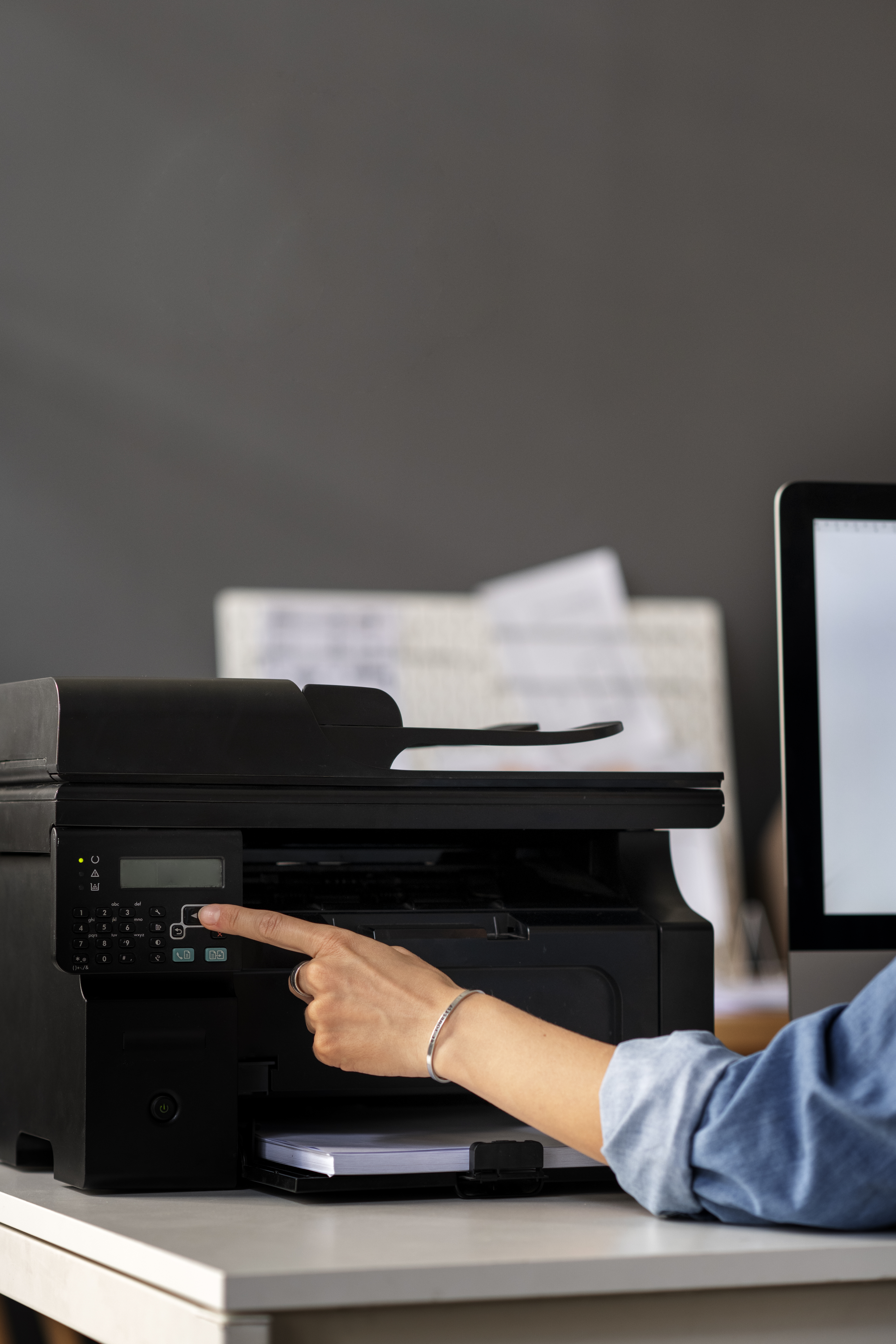 side view employee using printer work